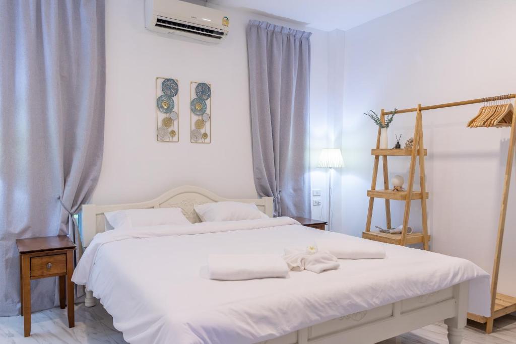 Postel nebo postele na pokoji v ubytování Apple Villas
