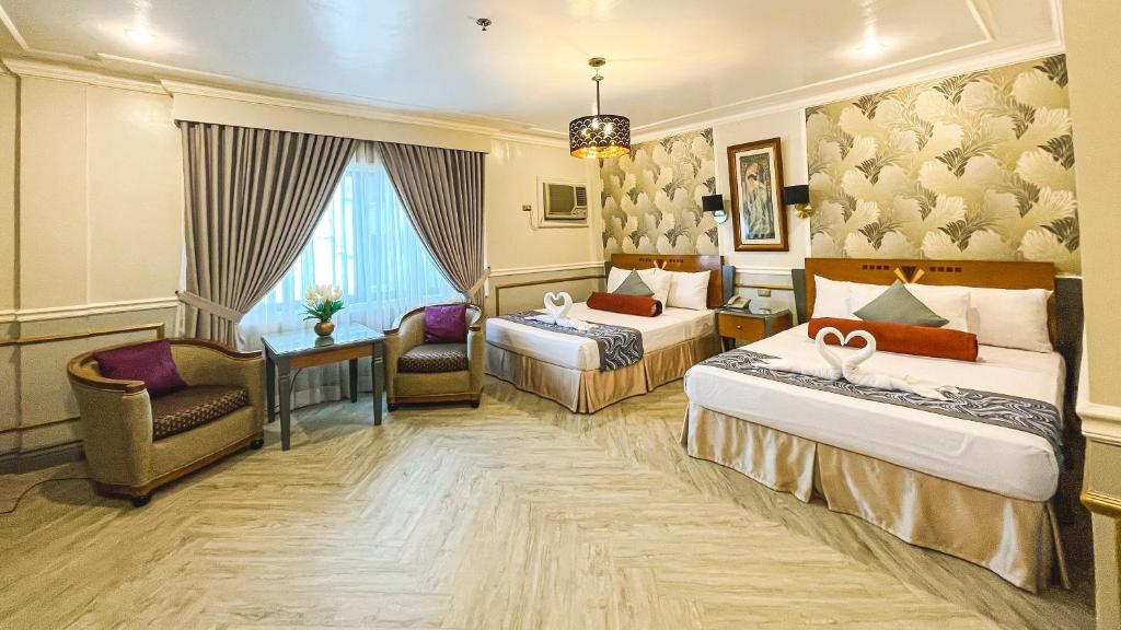 Postel nebo postele na pokoji v ubytování Miramar Hotel