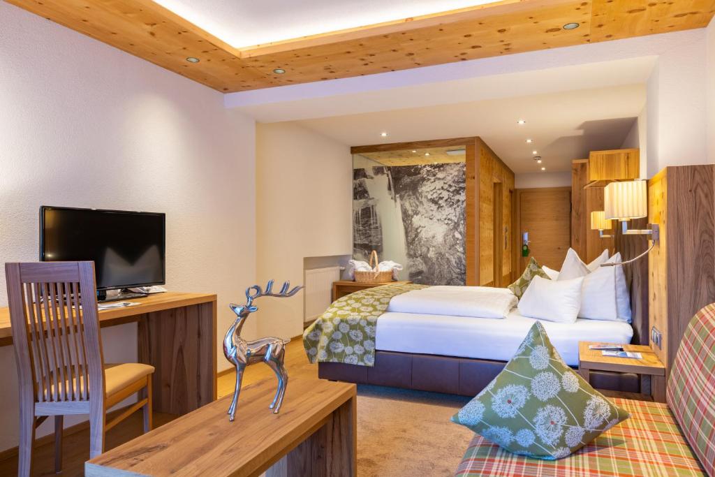 Postel nebo postele na pokoji v ubytování Hotel Olympia