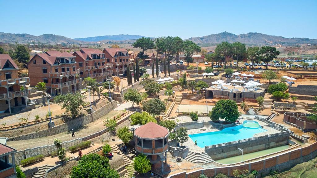 an aerial view of a city with a pool and buildings at Oceanis Park Andakana 