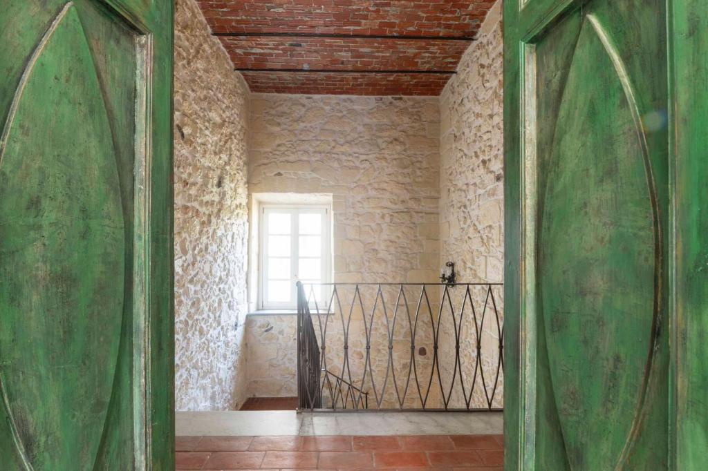 an open door to a room with a window at Vintage Cavour Apartment in Sassari