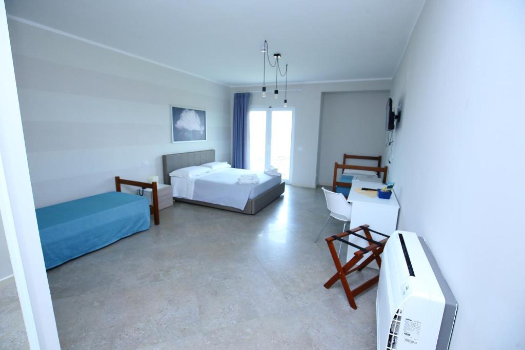 Postel nebo postele na pokoji v ubytování Sand Hotel