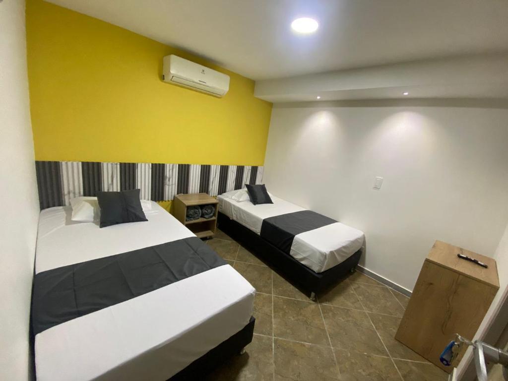 Postel nebo postele na pokoji v ubytování HOTEL ESTADIO DORADO