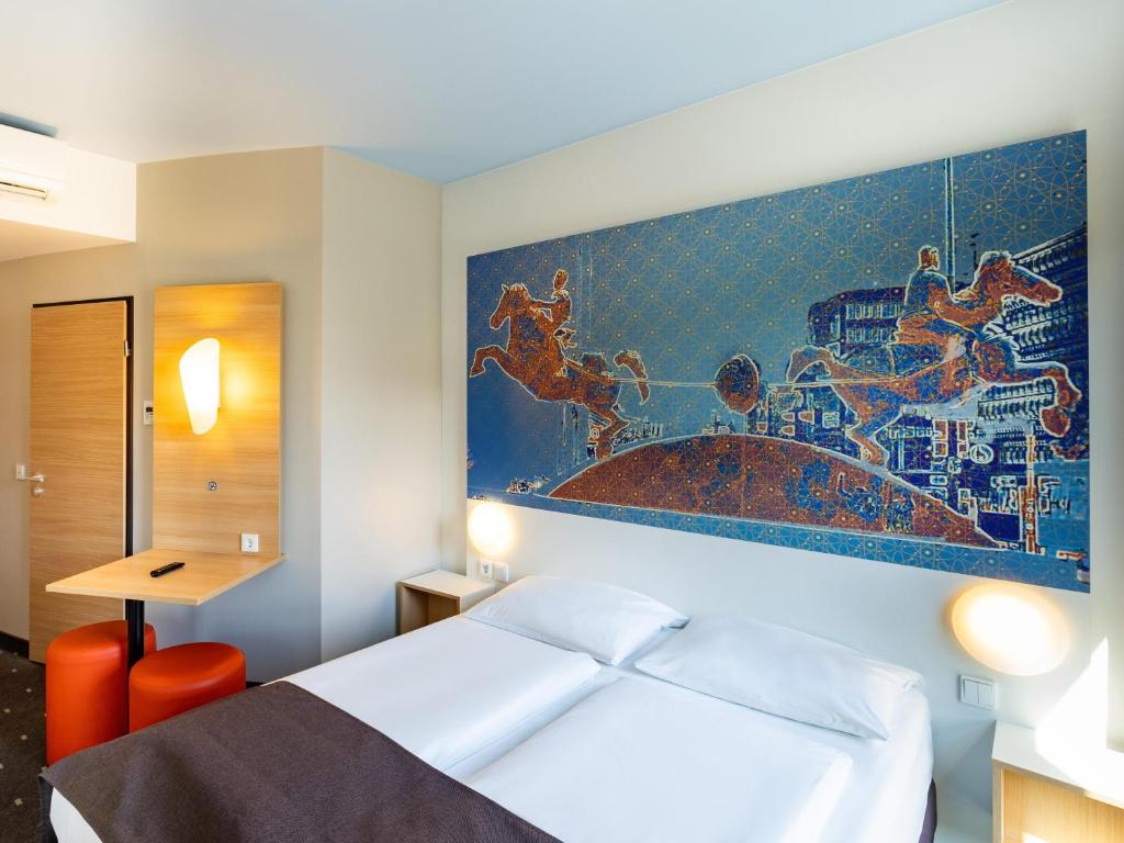 Postel nebo postele na pokoji v ubytování B&B HOTEL Magdeburg-City