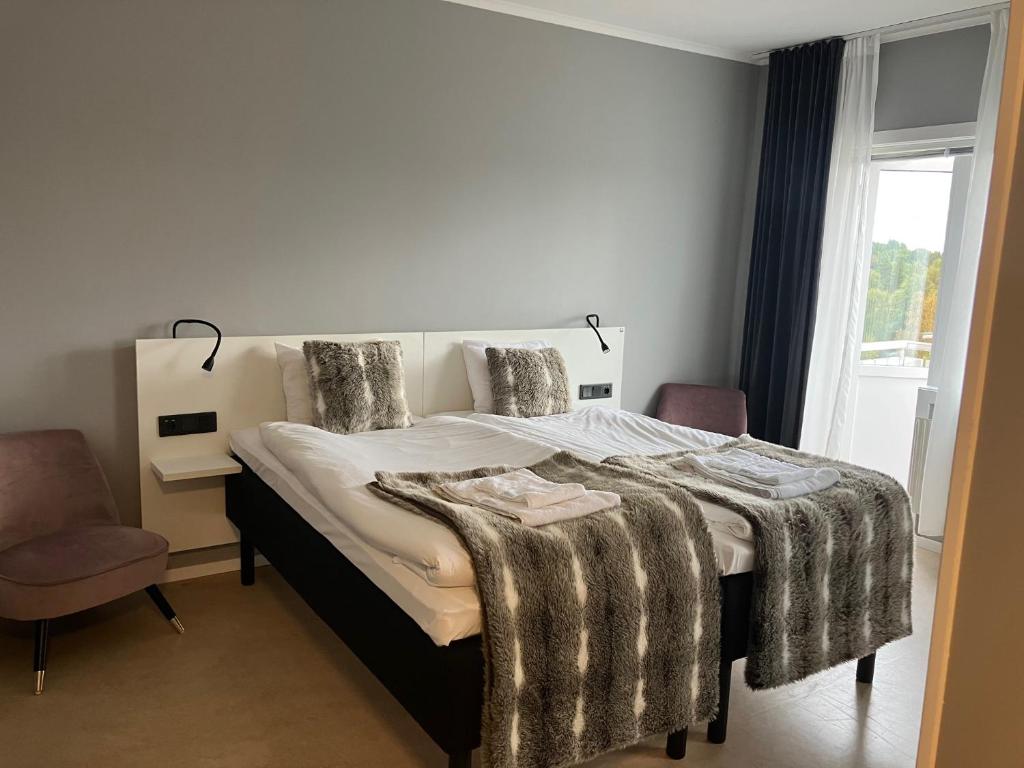 Postel nebo postele na pokoji v ubytování Marsfjäll Mountain Lodge Hotell i Saxnäs