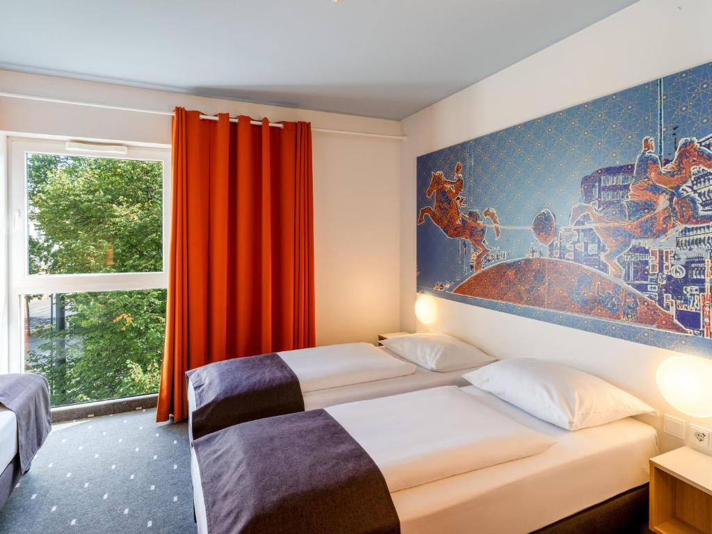 Postel nebo postele na pokoji v ubytování B&B HOTEL Magdeburg-City