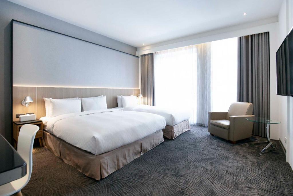 Postel nebo postele na pokoji v ubytování Dandy Hotel - Tianjin Branch