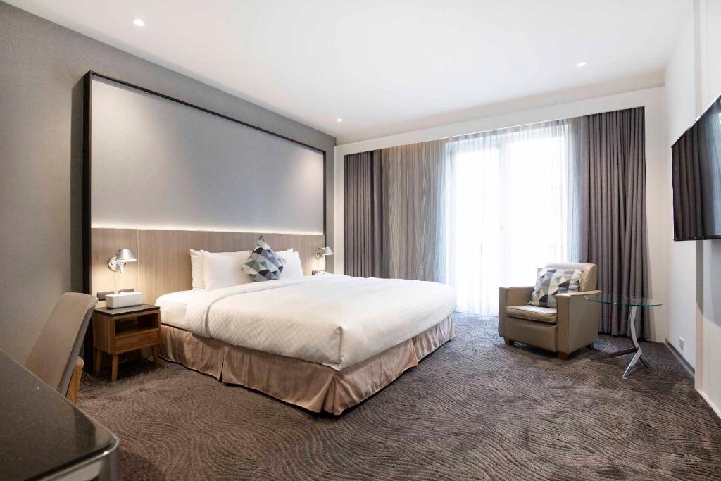 Postel nebo postele na pokoji v ubytování Dandy Hotel - Tianjin Branch