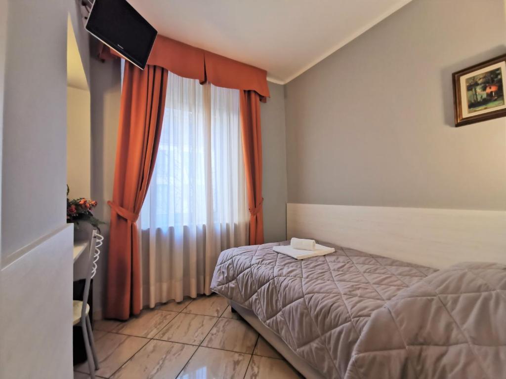 Postel nebo postele na pokoji v ubytování Hotel Brianza