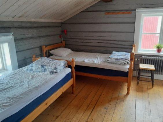Postel nebo postele na pokoji v ubytování Marsfjäll Mountain Lodge Vandrarhem i Saxnäs