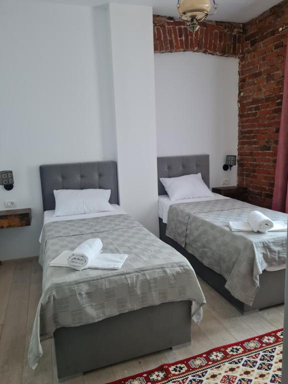 Postel nebo postele na pokoji v ubytování Conacul Ancuței