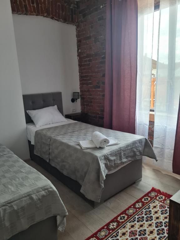 Postel nebo postele na pokoji v ubytování Conacul Ancuței