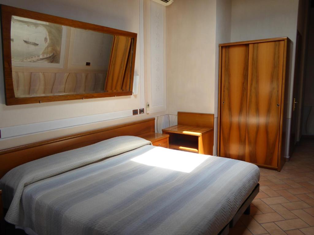 Postel nebo postele na pokoji v ubytování Albergo Giulia Gonzaga