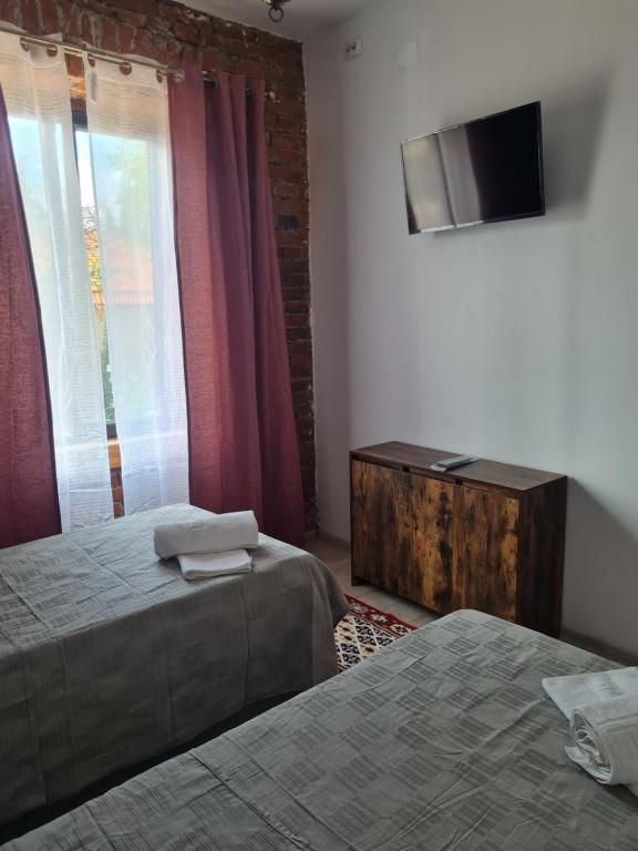 Postel nebo postele na pokoji v ubytování Conacul Ancuței