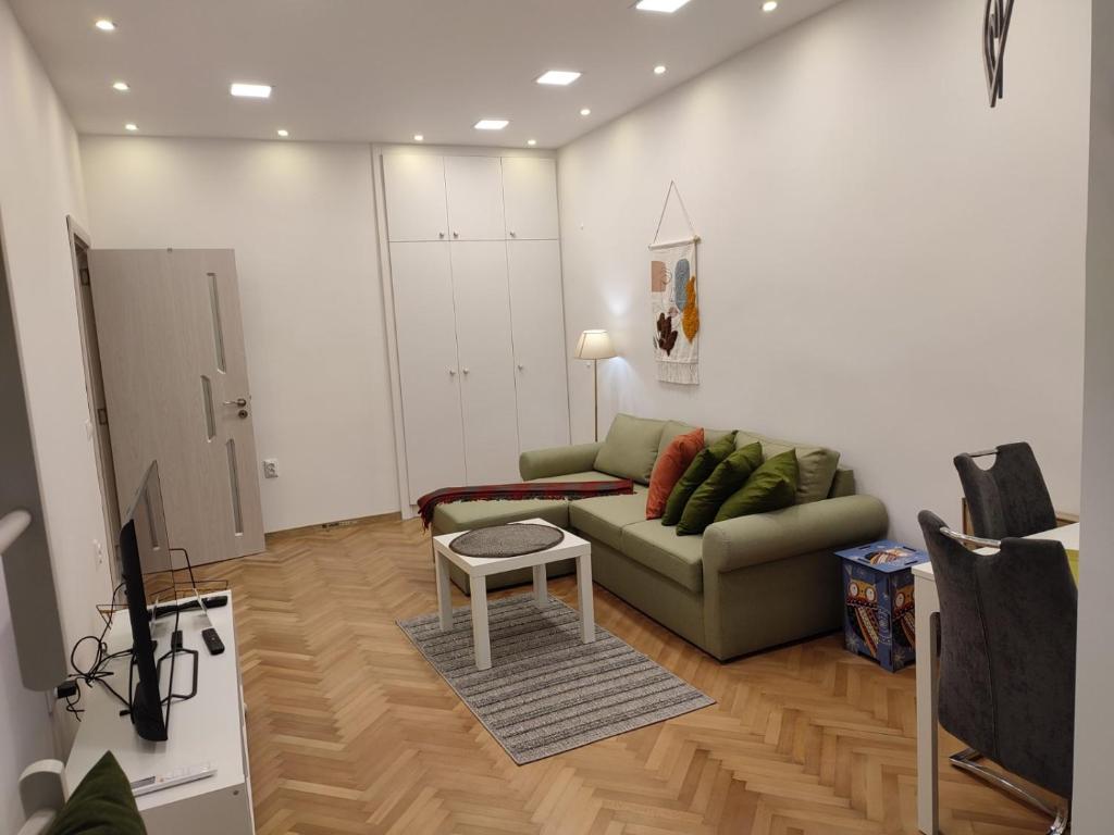 a living room with a couch and a table at Desafinado in Burgas City