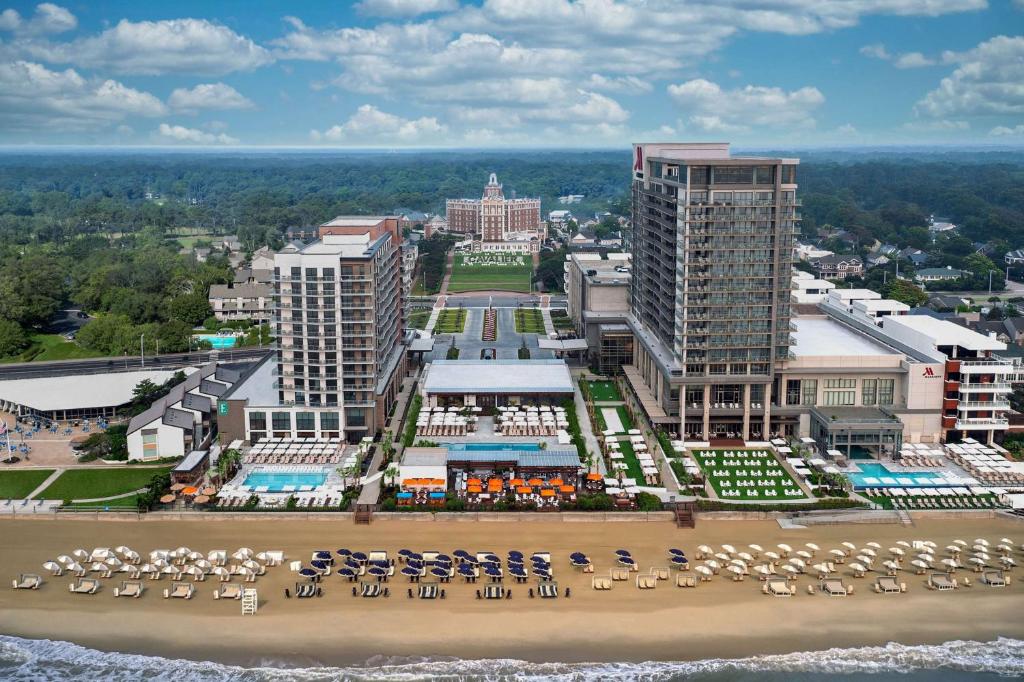 an aerial view of a city with a beach and buildings at Embassy Suites By Hilton Virginia Beach Oceanfront Resort in Virginia Beach