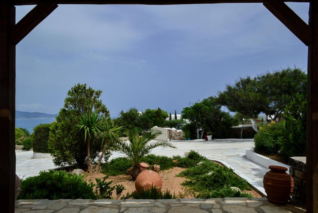 a view of a garden with plants and trees at Villa Peristeri in Agios Georgios