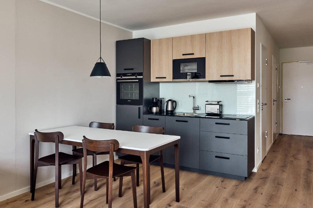 Kuchyň nebo kuchyňský kout v ubytování Arbio I Makro Apartments