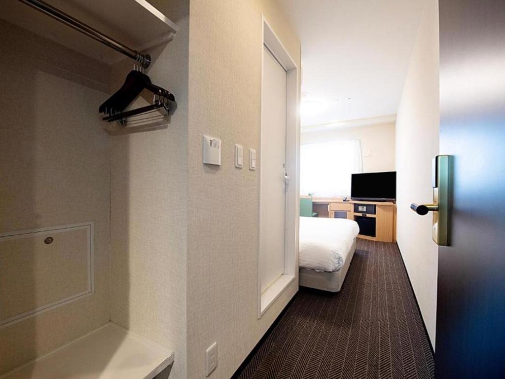 TV a/nebo společenská místnost v ubytování Nest&Rise Osaka Namba Hotel