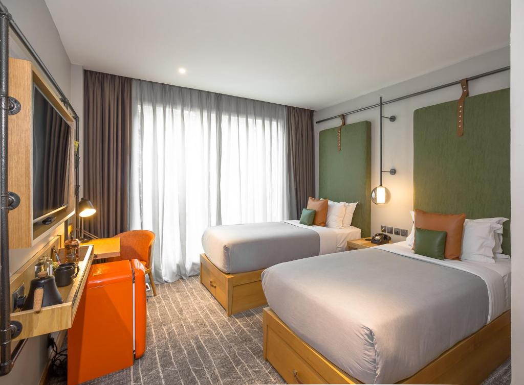 Postel nebo postele na pokoji v ubytování The Social House Nairobi, a Preferred Lifestyle Hotel