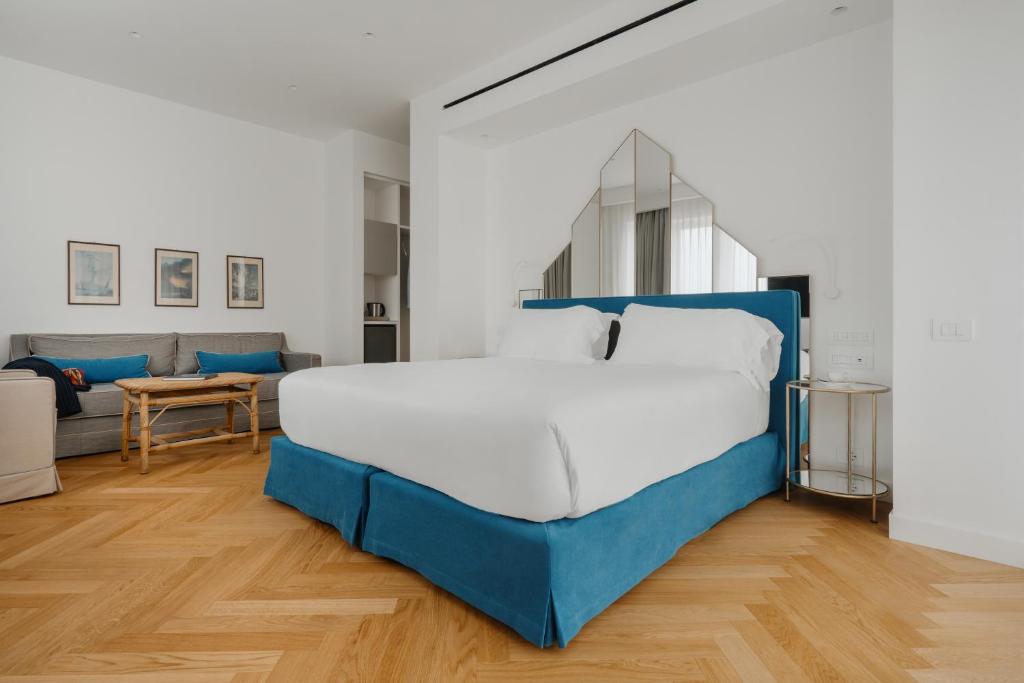 Postel nebo postele na pokoji v ubytování Hotel Morfeo