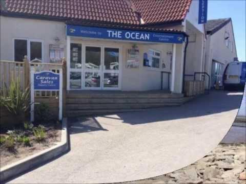 a store with a sign in front of a building at 8 person static caravan in Heysham