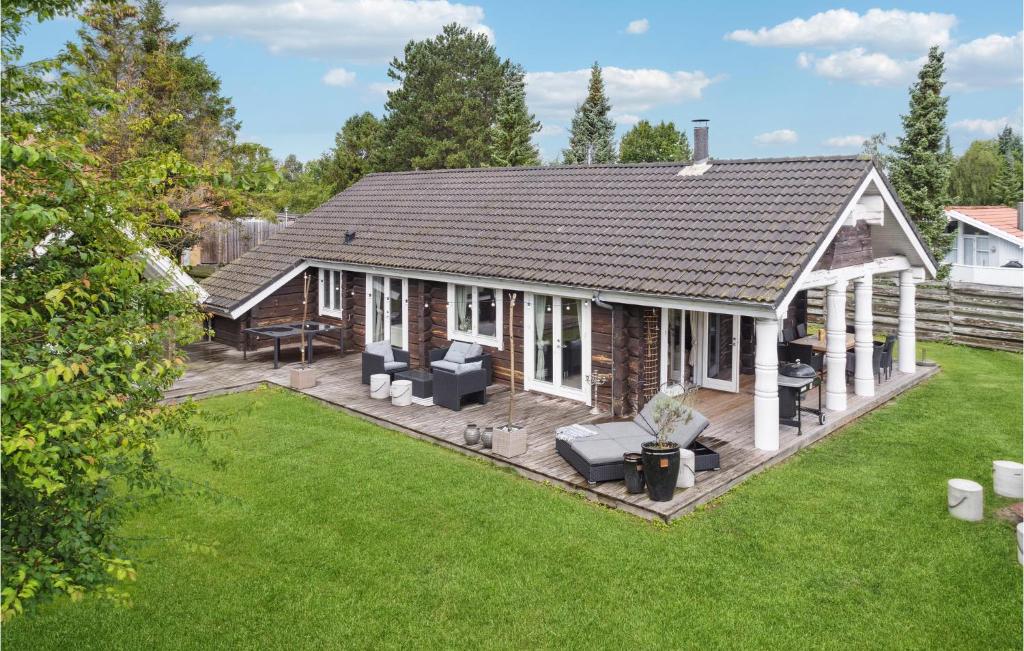 an overhead view of a house with a patio at Gorgeous Home In Væggerløse With Sauna in Marielyst
