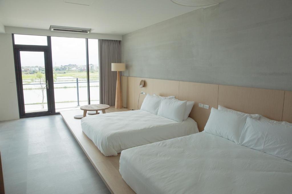 Postel nebo postele na pokoji v ubytování Golden Harvest Homestay