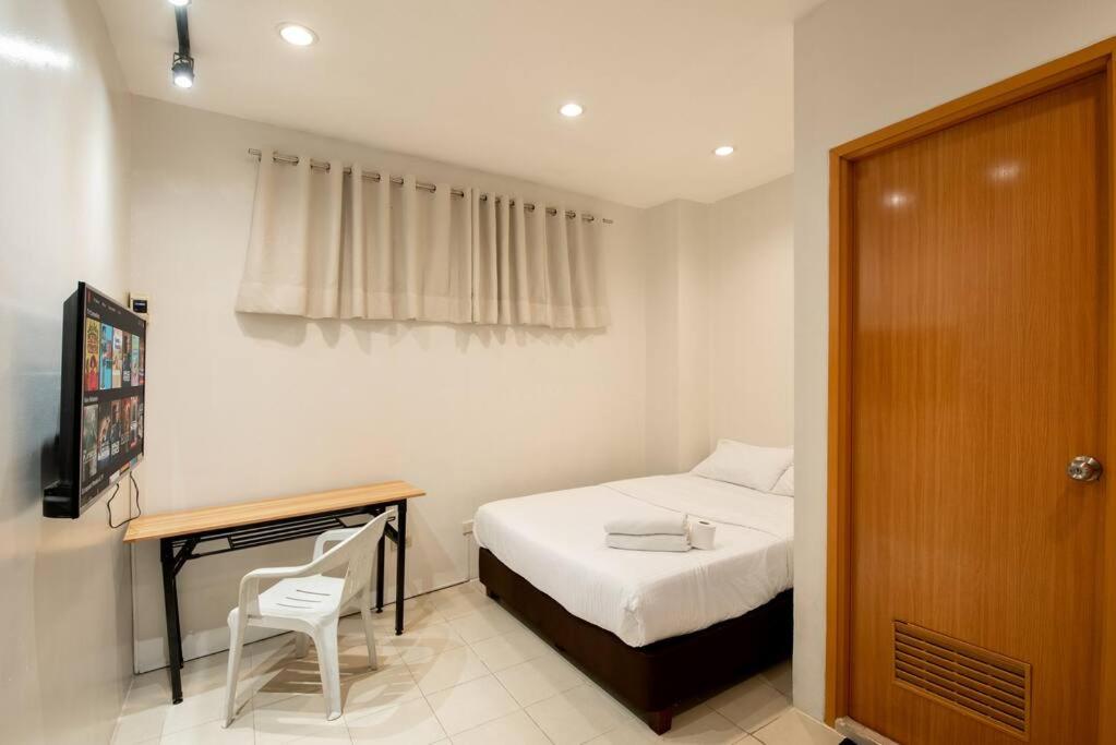 Ένα ή περισσότερα κρεβάτια σε δωμάτιο στο JP Santiago Studio Makati J204