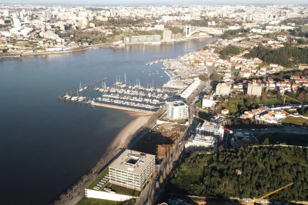 an aerial view of a harbor with boats in the water at DOURO VIEWS Luxury Design Beach Apartment in Vila Nova de Gaia