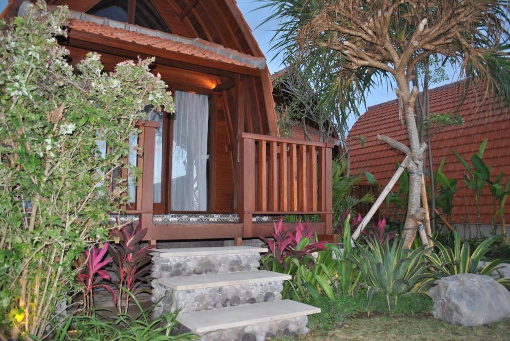a house with stairs leading up to a porch at Love Without boundaries num9842 in Siyut