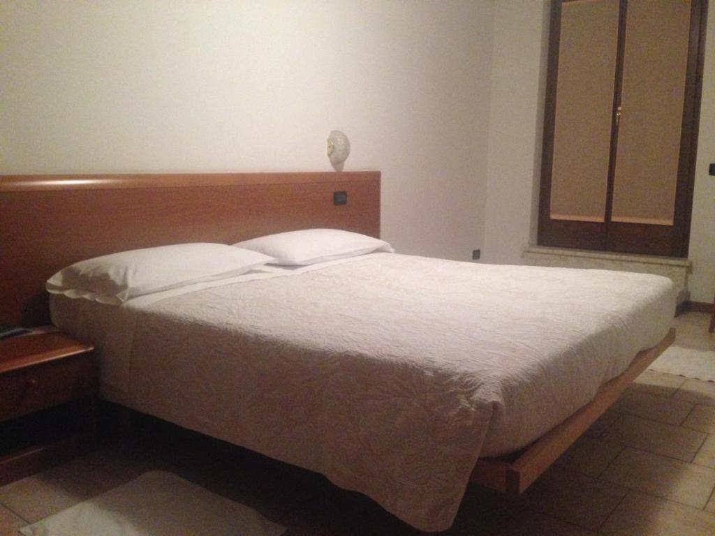 Postel nebo postele na pokoji v ubytování Hotel Scandola