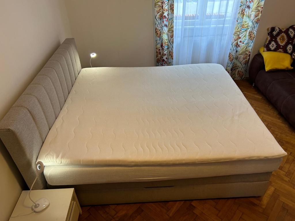 a bed in a small room with a mattress at Urban Apartment for Erasmus Student, Zentrum in Graz
