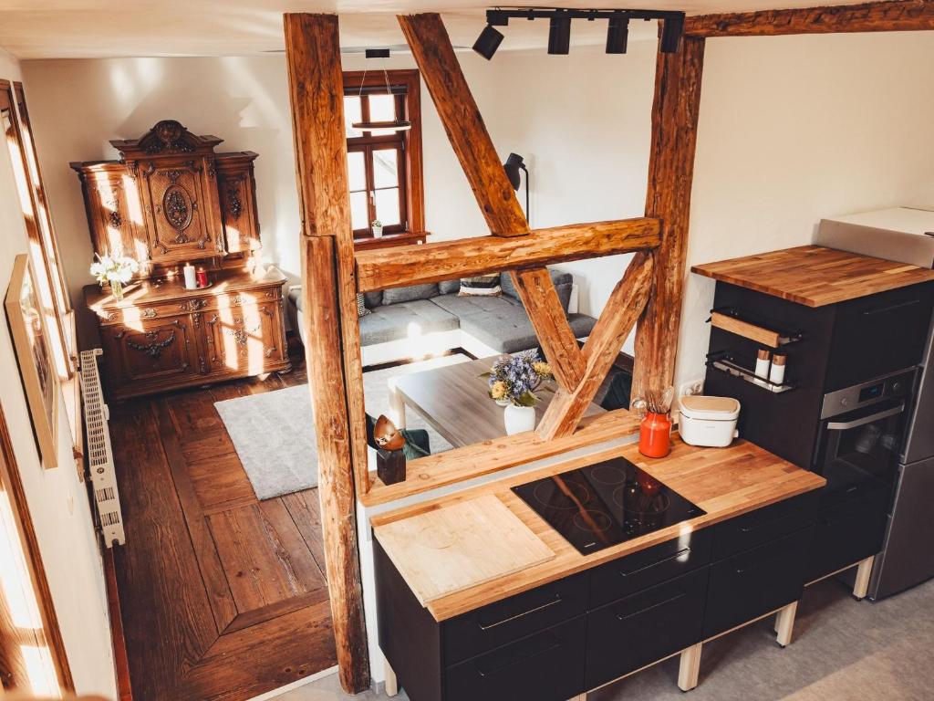 a kitchen with a stove top oven in a room at Ferienwohnung Brühler Hof in Bad Berka