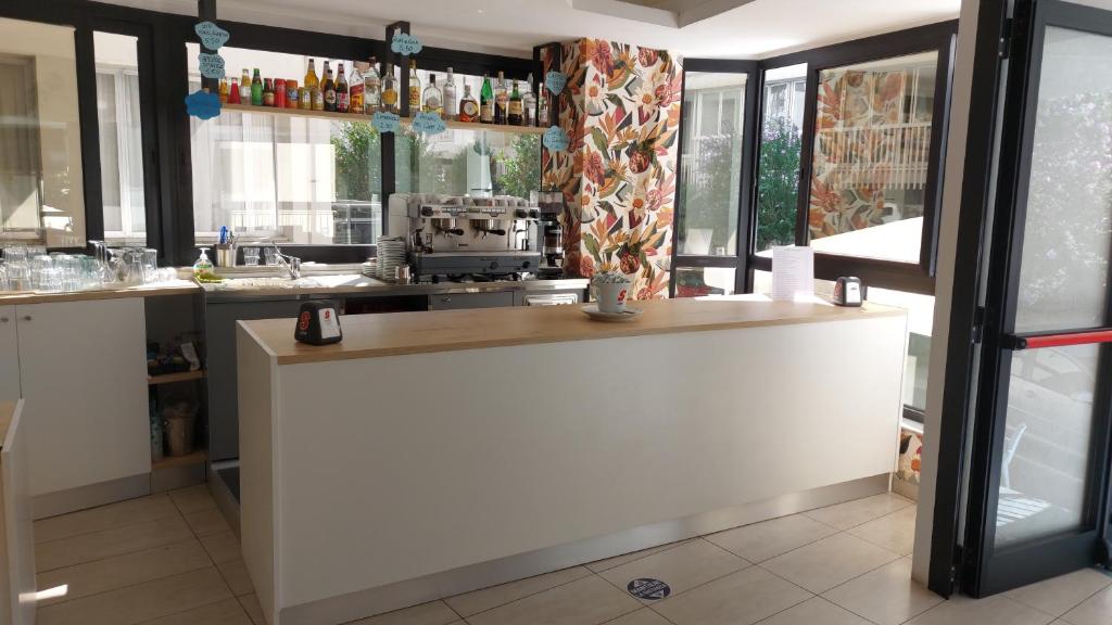 Kuchyň nebo kuchyňský kout v ubytování Hotel Clipper