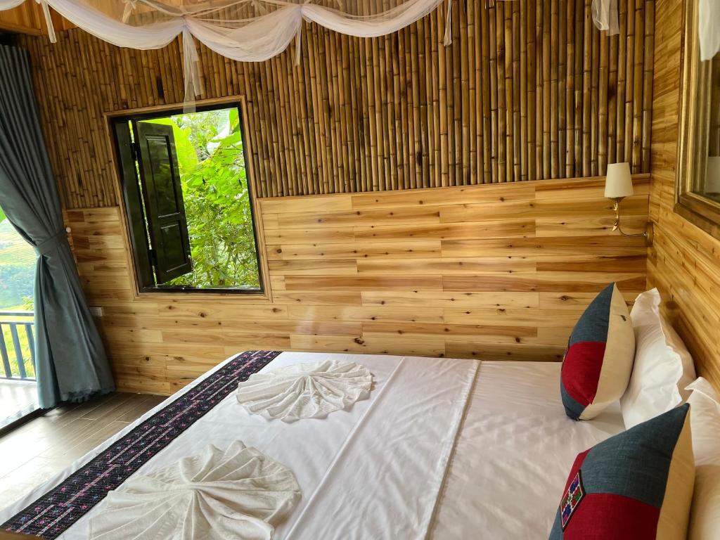 Postel nebo postele na pokoji v ubytování Hmong house Sapa