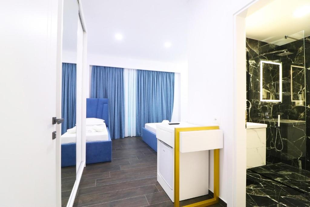 Postel nebo postele na pokoji v ubytování Memi Hotel