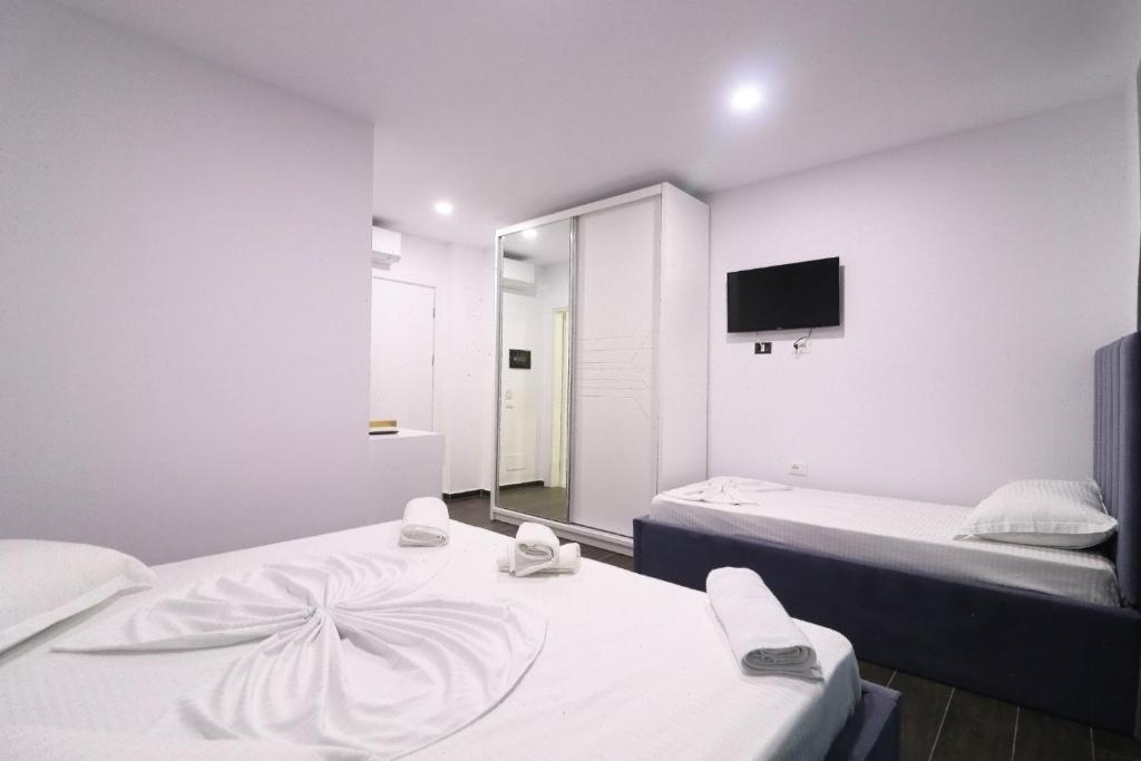 Postel nebo postele na pokoji v ubytování Memi Hotel