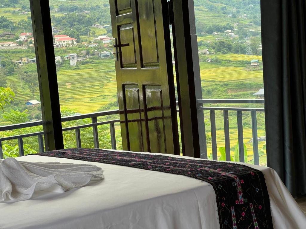 Postel nebo postele na pokoji v ubytování Hmong house Sapa