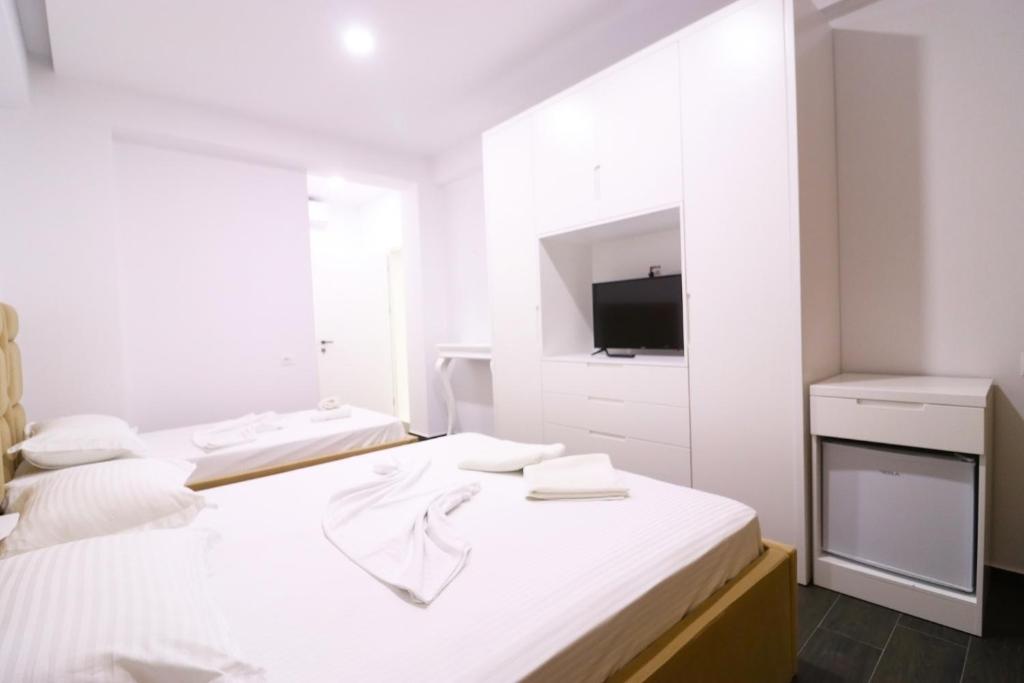Postel nebo postele na pokoji v ubytování Memi Hotel