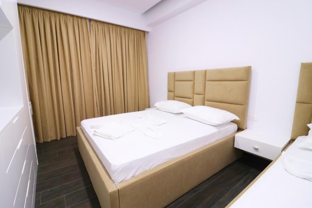 Postel nebo postele na pokoji v ubytování Memi Hotel