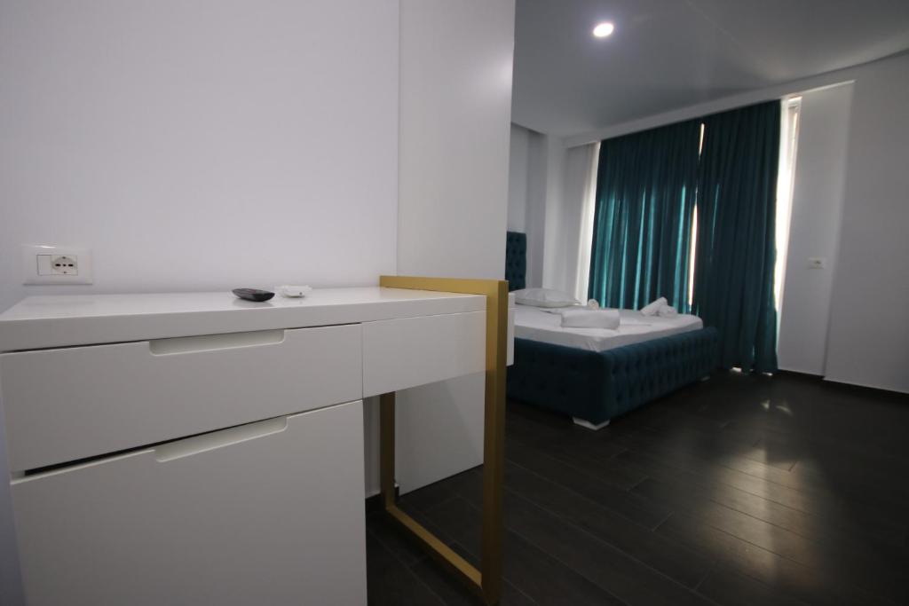 Postel nebo postele na pokoji v ubytování Memi Hotel