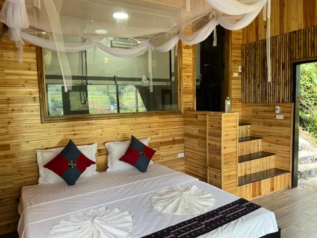 Postel nebo postele na pokoji v ubytování Hmong house Sapa