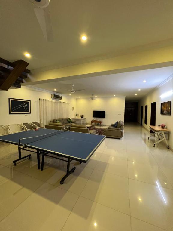 a living room with a ping pong table in it at DHA 2 Islamabad in Islamabad