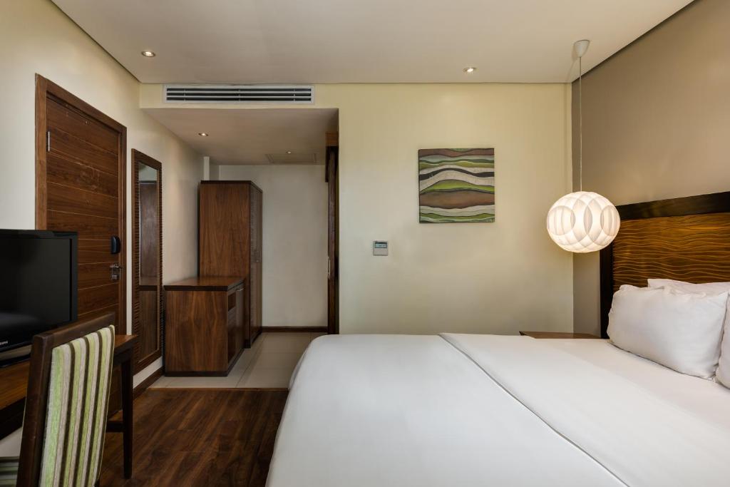 Postel nebo postele na pokoji v ubytování Protea Hotel by Marriott Benin City Select Emotan