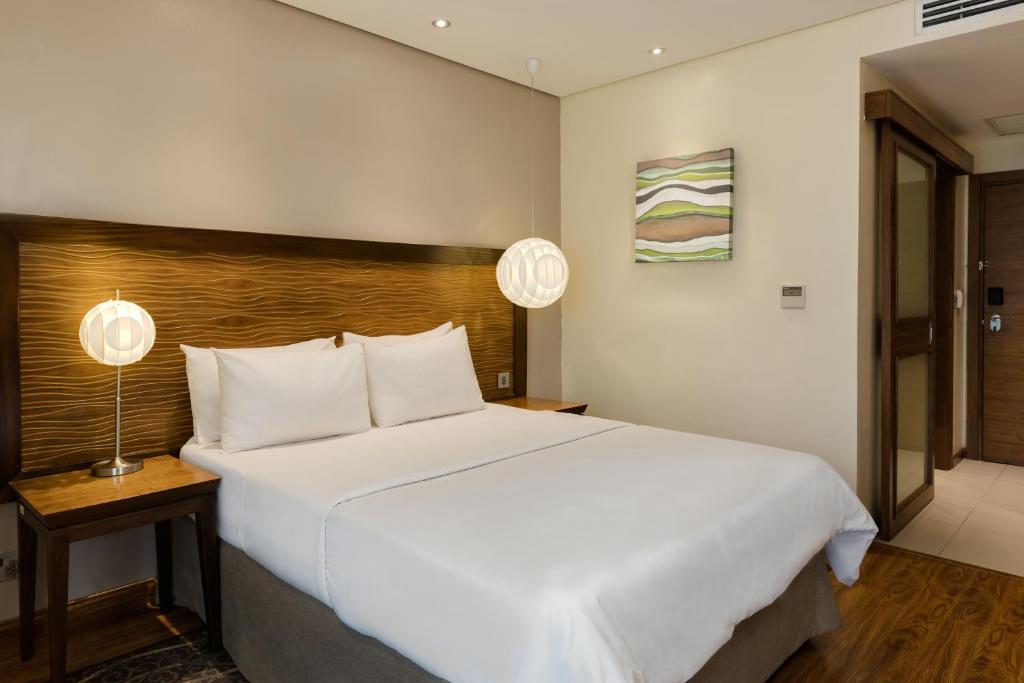 Postel nebo postele na pokoji v ubytování Protea Hotel by Marriott Benin City Select Emotan
