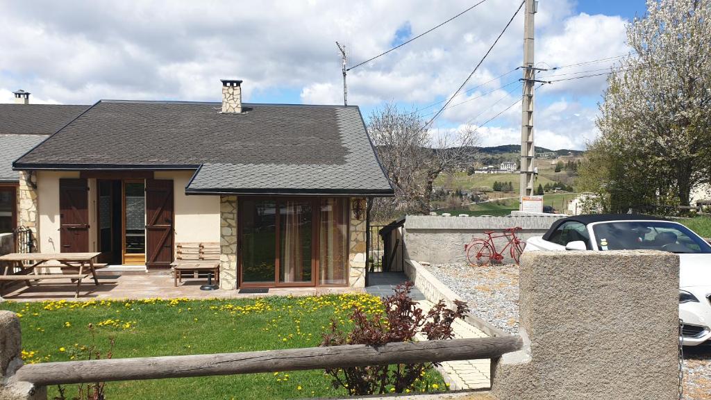 a house with a fence in front of it at CHEZ ANTOINE in Saint-Pierre-dels-Forcats