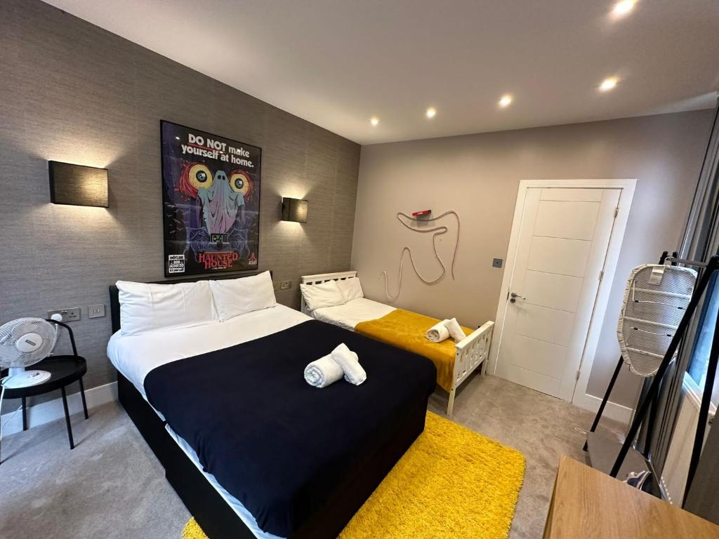 a hotel room with a bed and a small room with at Themed Stunning 1-Bed Apartment in London in London