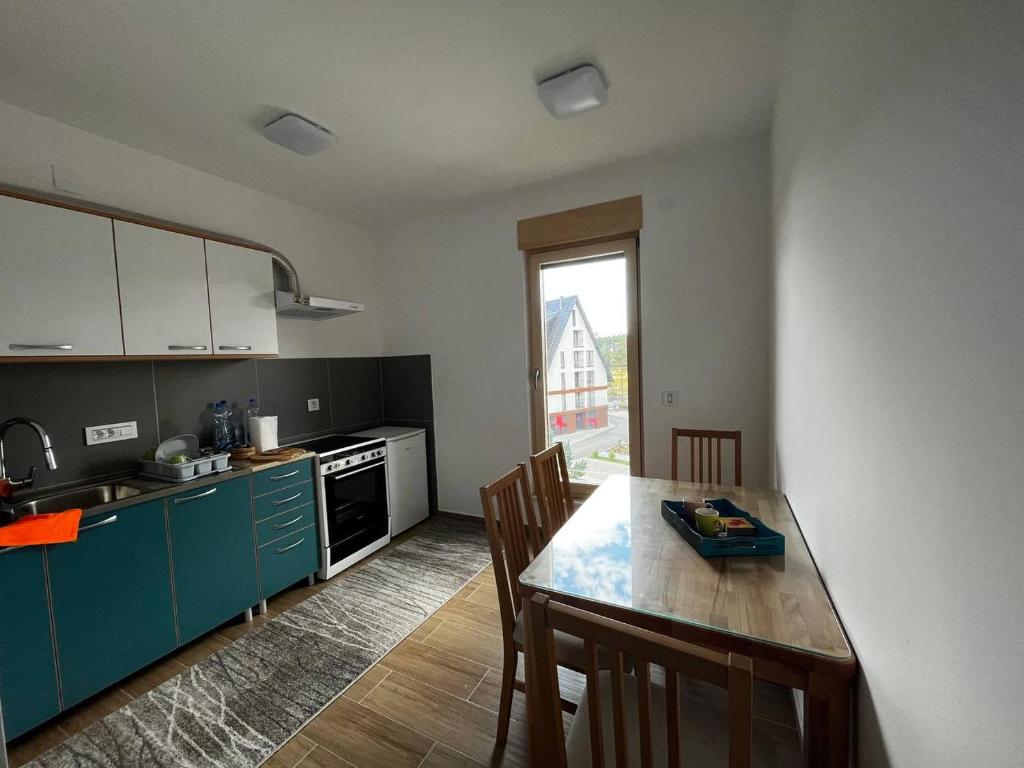 Kuchyň nebo kuchyňský kout v ubytování Sova apartman