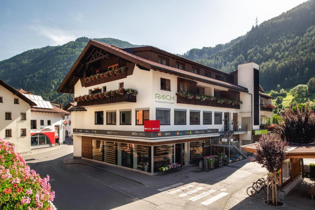 a large building in the middle of a street at Ferienresidenz Raich in Ried im Oberinntal